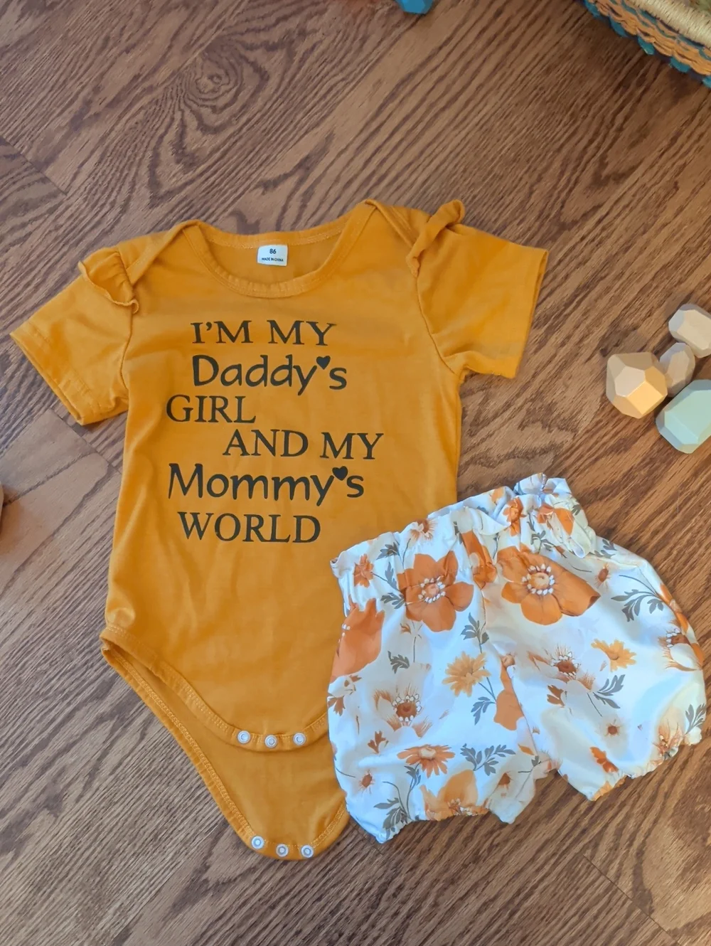 Mustard Orange Graphic Onesie with White & Orange Floral Shorts Set
